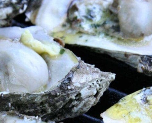 Grilled Oysters with Roasted Garlic